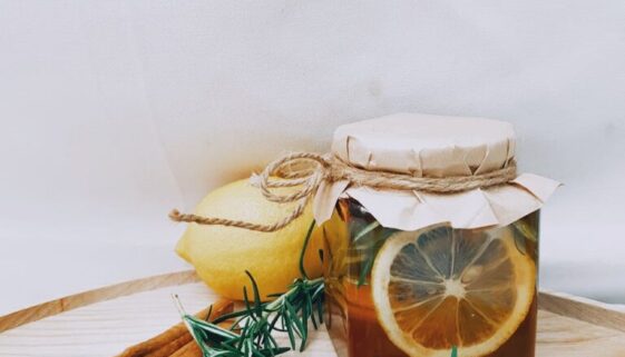 photo of jar near cinnamon sticks